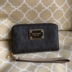 New condition Michael Kors Wristlet dark brown
